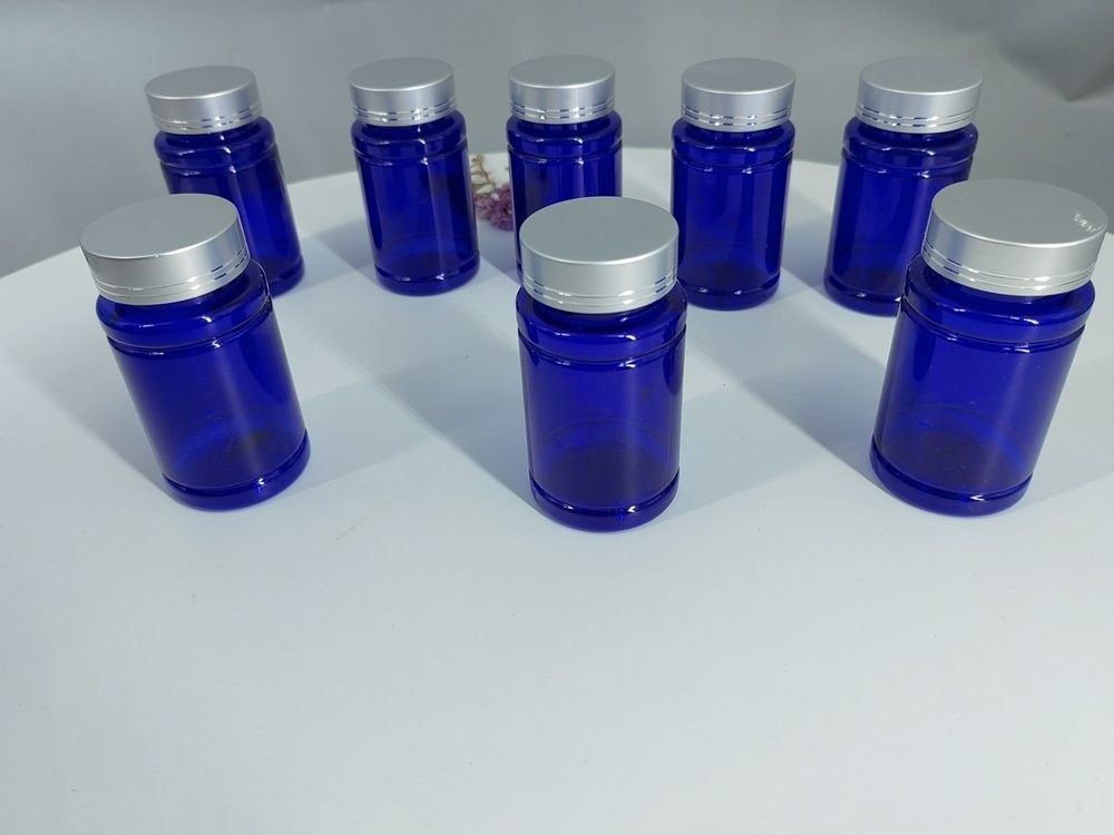 بطری کپسول 100 میلی لیتر پلاستیکی آبی PET با کلاه پیچ نقره ای